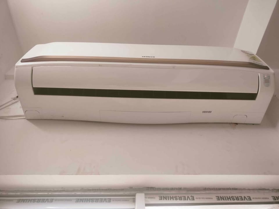 Hitachi 2 ton class 5 star expandable inverter split AC indoor unit installed on wall near ceiling