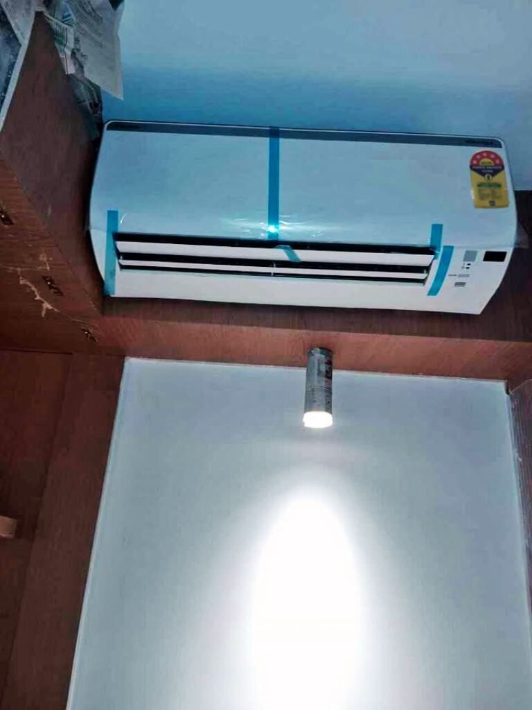 Daikin 1 Ton 5 Star FTKM35U split AC indoor unit with the front louver slightly open.
