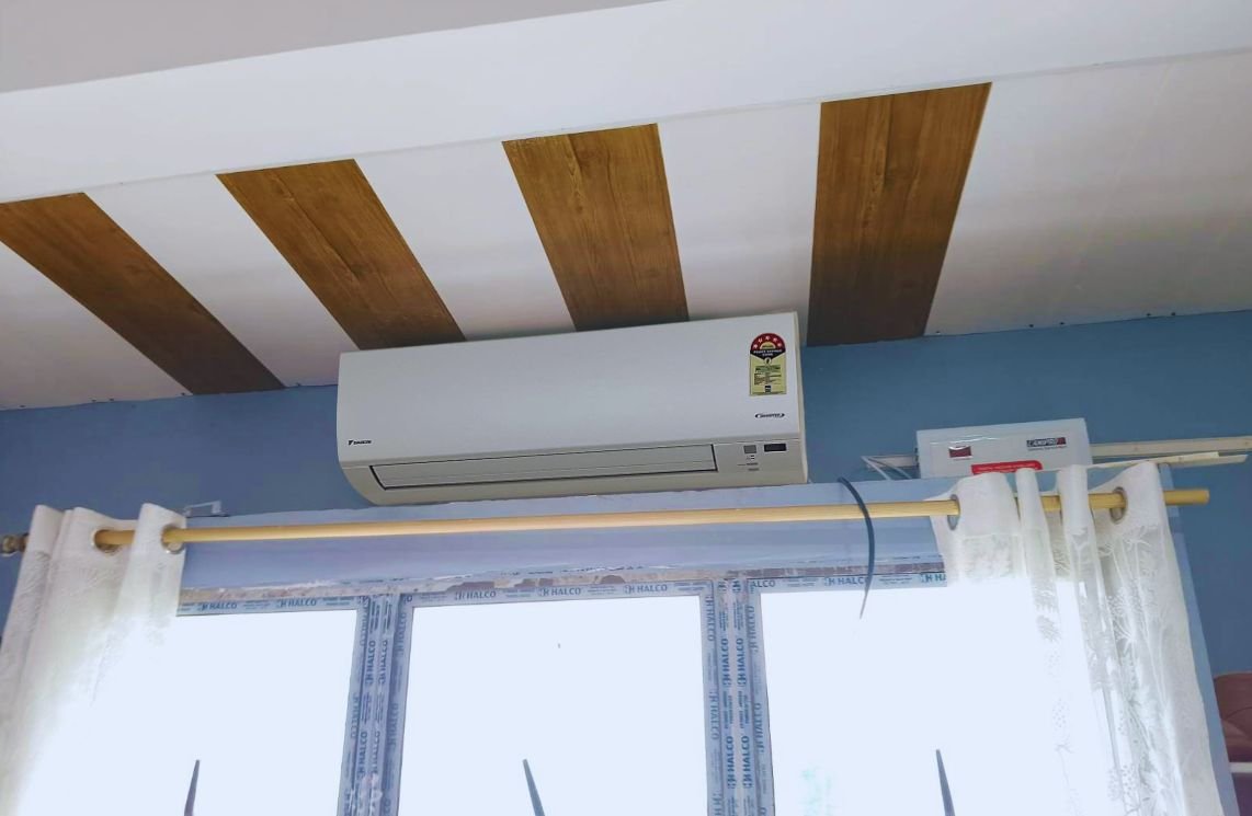 Close view of Daikin 1.5 Ton 5 Star ATKM50UV16VA installed wall mounted near to ceiling